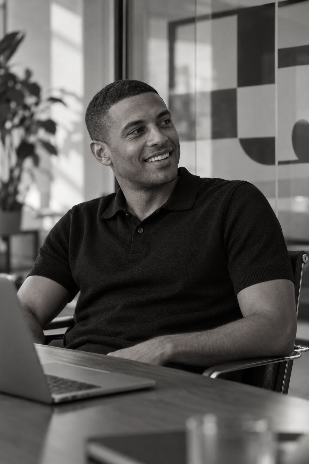 Media strategist listening at a meeting in black and white